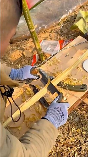 Handcrafting Wooden Tools: A Craftsman Carefully Shaping Wood by Hand