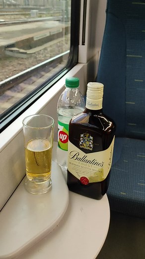 Discovering Ballantine's Whisky on a Scenic Train Ride