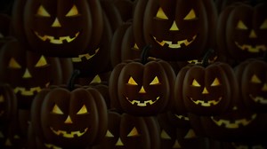 Download Scary dark Halloween pumpkins motion background animation. Evil, menacing pumpkins with flaming eyes. Full HD and a seamless loop. for free