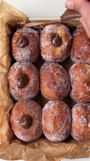 Nutella-Stuffed Brioche Donuts 🍩 For the tangzhong: 1/4 cup (30g) all-purpose flour 2/3 cup (150g) milk For the dough: 3 1/2 (420g ) all-purpose flour 2 1/4 tsp (7g) instant yeast 1 1/4 tsp (8g) salt 3 1/2 tbsp (45g) sugar 1 1/2 tsp (10g) honey 1/4 cups 1 tbsp (60g) softened butter 1 large egg 1 egg yolk, room temp 100–120g warm milk (add more only if needed) 1 tbsp vanilla bean paste For the filling : Nutella, as needed For frying: Neutral oil For coating: Granulated sugar Method: For tangzhon