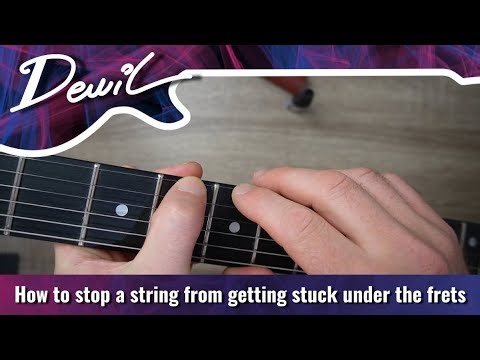 How to stop a string from getting stuck under the frets