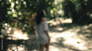 Scared woman running away from strange presence behind her