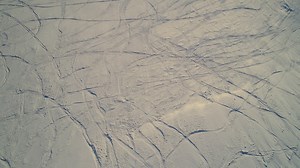 Ski tracks in the mountain snow - Free Stock Video