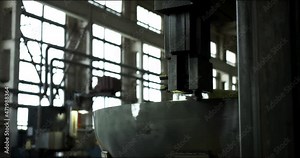 Automated lathe. The process of metal cutting at a modern production facility. Metal shavings. Production of heavy industry and large-sized metal structures. Modern steel industry.