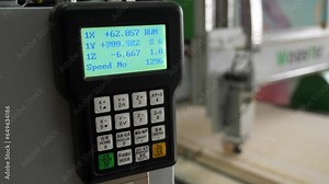 The control panel of the woodworking machine with CNC. The screen of a modern automatic wood cutting machine. A CNC stencil machine. Modern woodworking machine.