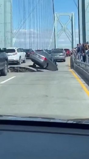 11K views · 34 reactions | Bridge starts collapsing right in front of traffic — pure nightmare fuel Cars are rolling forward, and suddenly the bridge drops out ahead. One car ends up hanging right over the gap — inches from falling. People froze. Driver froze. Everyone got a lifetime dose of adrenaline  #wow #ai #fail #really #crash #bridge #collapse #near #scary #caught #viralvideo #sos #what #no #cars #shit #wtf #earthquake | The.worldai | Facebook
