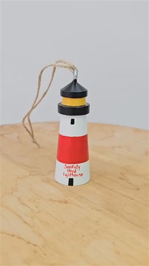 Sankaty Head Lighthouse Christmas ornament. Available on my Etsy shop. I am doing low-key limited quantities on everything in my Etsy shop for the remainder of this year. By the end of November, I will be putting my Etsy shop on vacation for the holidays and reopening again in early 2026. #sankatylighthouse #christmas #ornaments | Beth Doan Maine Artist