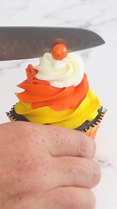 Happy Halloween! 💛🧡🤍Candy Corn Cupcakes - cute chocolate cupcakes with a hidden surprise inside! Disclaimer: yes, I know it’s a lot of frosting. No, you don’t have to make them like this - if you want to use less frosting, I suggest keeping the frosting candy corn on the inside and finishing these with a thin layer of frosting on top. Customize them to suit your taste! Full recipe lots more info: https://www.sugarhero.com/candy-corn-cupcakes/ #candycorn #cupcakes #halloween #frosting | SugarH