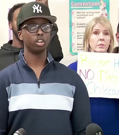 🚨 LMAO! The “owner” of Somali Nokomis Daycare is DOUBLING DOWN, saying someone broke in and stole STUDENT ENROLLMENT and employee documentation Even though Minneapolis Police say he’s LYING, and NOTHING was stolen. This is beyond parody at this point 🤣 And of course, there’s a self-hating white women behind him holding a sign about “racism” | News Snapper