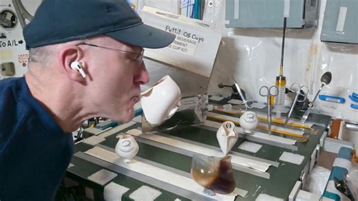 Astronaut shows how to drink a cup of coffee in SPACE
