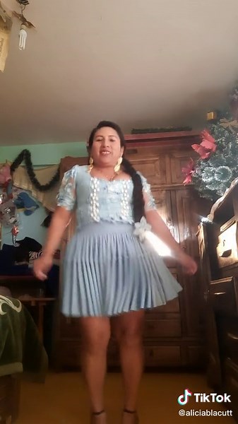 Twirling in a Light Blue Dress: A Dance of Elegance