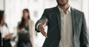 Crop close up view unknown businessman in suit extend arm for handshake to camera, greeting applicant to company vacant place position. Manager welcoming corporate client, make deal, express regard