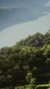 Scenic countryside landscape with green summer mountain valley and forests