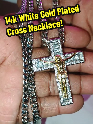 Vogcome 14 Karat White Gold Plated Cross Necklace is a bold 24 inch necklace designed to shine with confidence and lasting quality, crafted to resist fading, discoloration, and turning your skin green so you can wear it every day without worry. This large oversized men's cross necklace features a brilliant iced-out crucifix design with a detailed gold-tone center set against a sparkling white gold plated finish, creating a powerful statement piece that instantly elevates your style. Whether you 