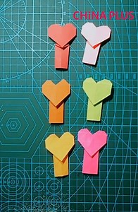 33K views · 718 reactions | This tutorial shows you how to fold paper into hearts and flowers. | China Plus Culture | Facebook