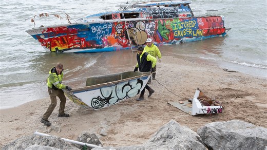 See Milwaukee's abandon boat top and cockpit get hauled away from the beach