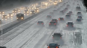 Commuters in heavy rain on the 118 Freeway leaving the west San Fernando Valley in Los Angeles, California.