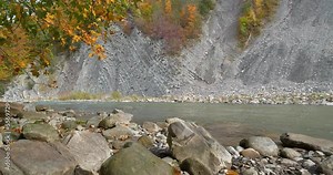 Beautiful autumn nature. The Prut river and mountain folds in Yaremche City, Carpathians, western Ukraine, known as Yaremche folds - biggest outcrop of Stryi formation in Europe