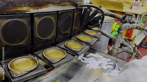 Fortune cookie making process at a factory in the San Francisco China town