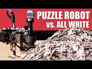 Worlds hardest jigsaw vs. puzzle machine (all white)