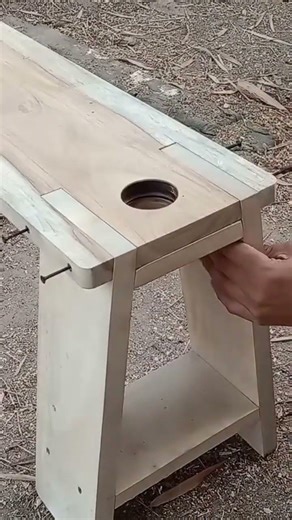 Joining a bench to wooden legs with bolts adds strength and includes side holes for bottle holders