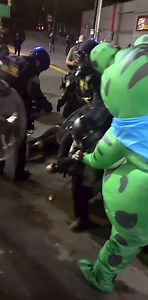 🚨 Portland Police pepper-spray the air vent of a frog costume worn by an anti-ICE protester at the Portland ICE facility. 😂😂😂😂😂😂😂 | Edie Cornelius