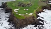 Pebble beach golf links with rugged coastline and crashing waves,...
