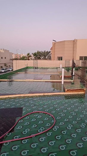 Roofing Techniques: Workers Install Waterproof Membrane