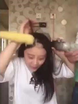 Girl tries to eat corn from a power drill, rips out hair instead