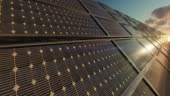 Close up of solar power panels farm against timelapse sunrise, 4K
