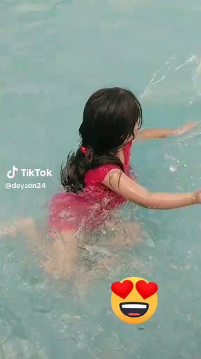 Young Girl's Joyful Moments in the Swimming Pool