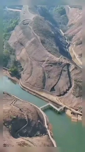 BUDDHA & MEDITATION on Instagram: "World's largest reclining Buddha statue in Jiangxi Visitors walk along the feet of the world's largest reclining Buddha stone statue in Yiyang county of East China's Jiangxi province, March 28, 2015. [Photo/SIPA] A reclining Buddha, a frequent theme in Buddhist art, signifies the Buddha Shakyamuni's departure into final nirvana. The gigantic rock work was constructed on a mountain in Yiyang county of East China's Jiangxi province and measures 68 meters high and