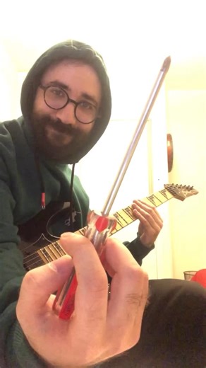 @farbod.pya on Instagram: "Honoring my master @partyzgit with this special arrangement of Colonel Bogey March by F.J. Ricketts! 🎸🔥 Using left-hand tapping for chords and a screwdriver as a slider for the melody—an experimental take on a classic! 🚀🎶 Composed in 1914, Colonel Bogey March became one of the most famous military marches, later popularized in The Bridge on the River Kwai (1957). Its whistling tune is recognized worldwide, and now, I’m giving it a fresh twist with this technique! #