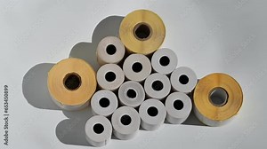 Rolls of white labels isolated. Labels for direct thermal or thermal transfer printing. Blank sticky label roll for thermal transfer printing pirce criss. Stock Video