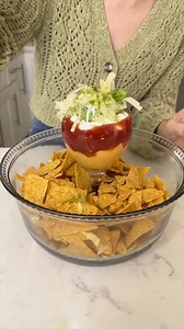 Genius salsa hack! I create a delicious layered dip in a glass as the centerpiece to a serving bowl. | Sam and Allie
