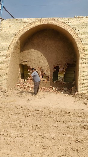 Demolishing a Brick Archway with a Sledgehammer