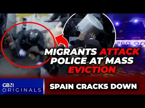 WATCH: Migrant MOB rush police and pelt officers with PANS as 400 men EVICTED from squat