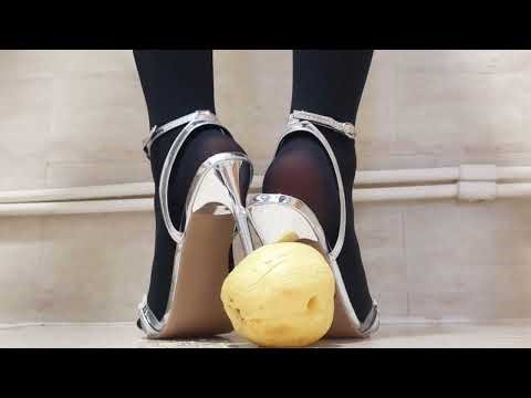 Stiletto HEELS crush an apple