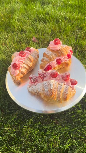 2.2K views · 56 reactions | Your fresh raspberry croissant with raspberry whipped cream 縷 Flaky. Buttery. Blissfully pink.  Our fresh raspberry croissant is layered with love — filled with tangy raspberry compote and topped with a swirl of raspberry-whipped cream so light it melts on your tongue. A little taste of Paris in every bite. 縷 #Parisbakeryandcafé 335Market St lewisburg 17837 | Paris Bakery & Café | Facebook