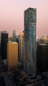 Radisson Blu Aqua Hotel on Instagram: "Designed by Jeanne Gang and completed in 2009, Aqua Tower made history as the tallest building designed by a woman and quickly became one of the most recognizable silhouettes on the Chicago skyline. Its rippling concrete facade mirrors the river's flow and the city's pulse. You’ve seen the outside, now experience what's inside. #RadissonBluAqua #DowntownChicago #ChicagoHotels #Chicago #CityStay #UrbanEscape #ExploreChicago"