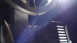 Film Projector - back-reflection of light on the background - Includes film projector audio Stock Video