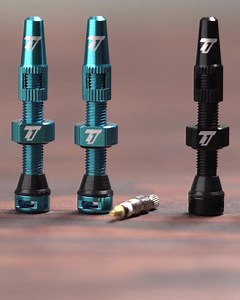 Our V.2 Tubeless Valve Stems have better clearance for tire inserts, alloy cap w/ a built in valve core remover, include an extra core & come in more colors 🤫 | Trail One Components