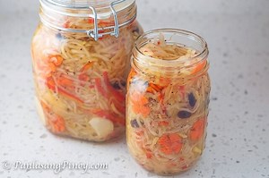 How to Make Atchara Recipe: https://panlasangpinoy.com/cook-papaya-atchara/ YouTube: http://bit.ly/PanlasangPinoyYouTube Facebook: http://bit.ly/PanlasangPinoyFacebook Instagram: http://bit.ly/PanlasangPinoyInstagram Website: http://bit.ly/PanlasangPinoyCom 3 lbs shredded green papaya 1 medium carrot thinly sliced 1 small red bell pepper julienne 3/4 cups raisins 1 head garlic sliced 4 thumbs ginger julienne 2 cups vinegar 1 1/3 cups granulated white sugar 1 teaspoon salt 1/2 teaspoon ground bla