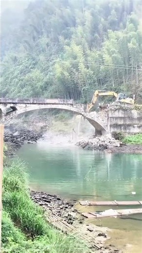 Pier Demolition! Excavator at Bridge Demolition Site: Water Splashes as Bridge Structure Collapses