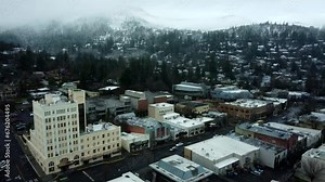 Ashland, Oregon, USA, Winter 2023. Downtown. Moving West over downtown with Ashland Springs Hotel to the leftand moving towards the Oregon Shakespeare Festival.