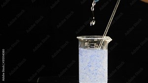 Making body care production beauty aroma perfume in laboratory conditions, Perfumer lab technician chemist cosmetician pouring cosmetic aroma glass test tube oil in liquid, Slow motion. Full hd