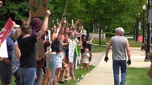 People gather at historic Howell courthouse, some to protest, others to protect memorial