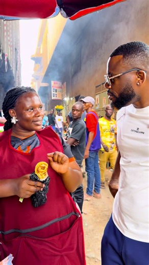 Trying Ugandan street food for the first time.