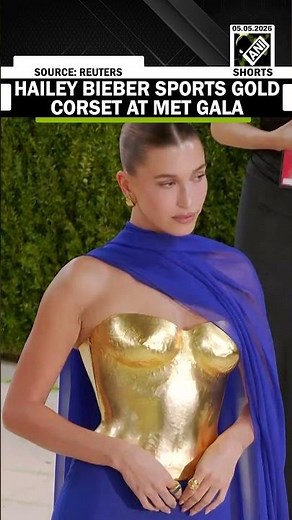 Hailey Bieber sports gold armour-style Saint Laurent look at Met Gala 2026