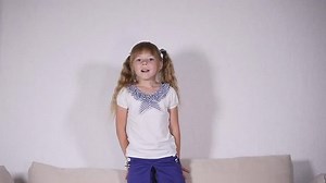 Happy children jumping on the bed and having fun.